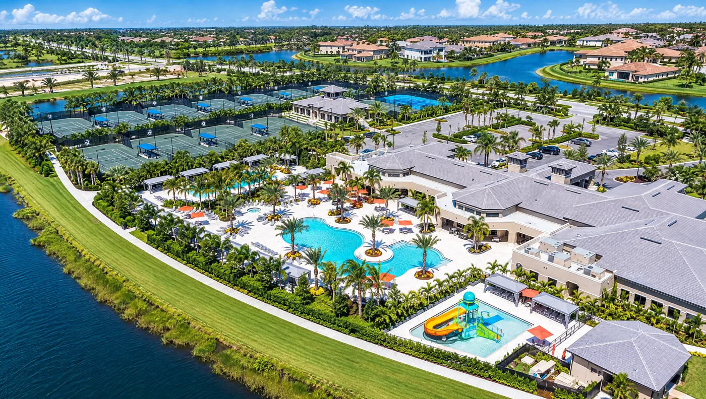 Seven Bridges clubhouse pools, splash area and tennis courts from above